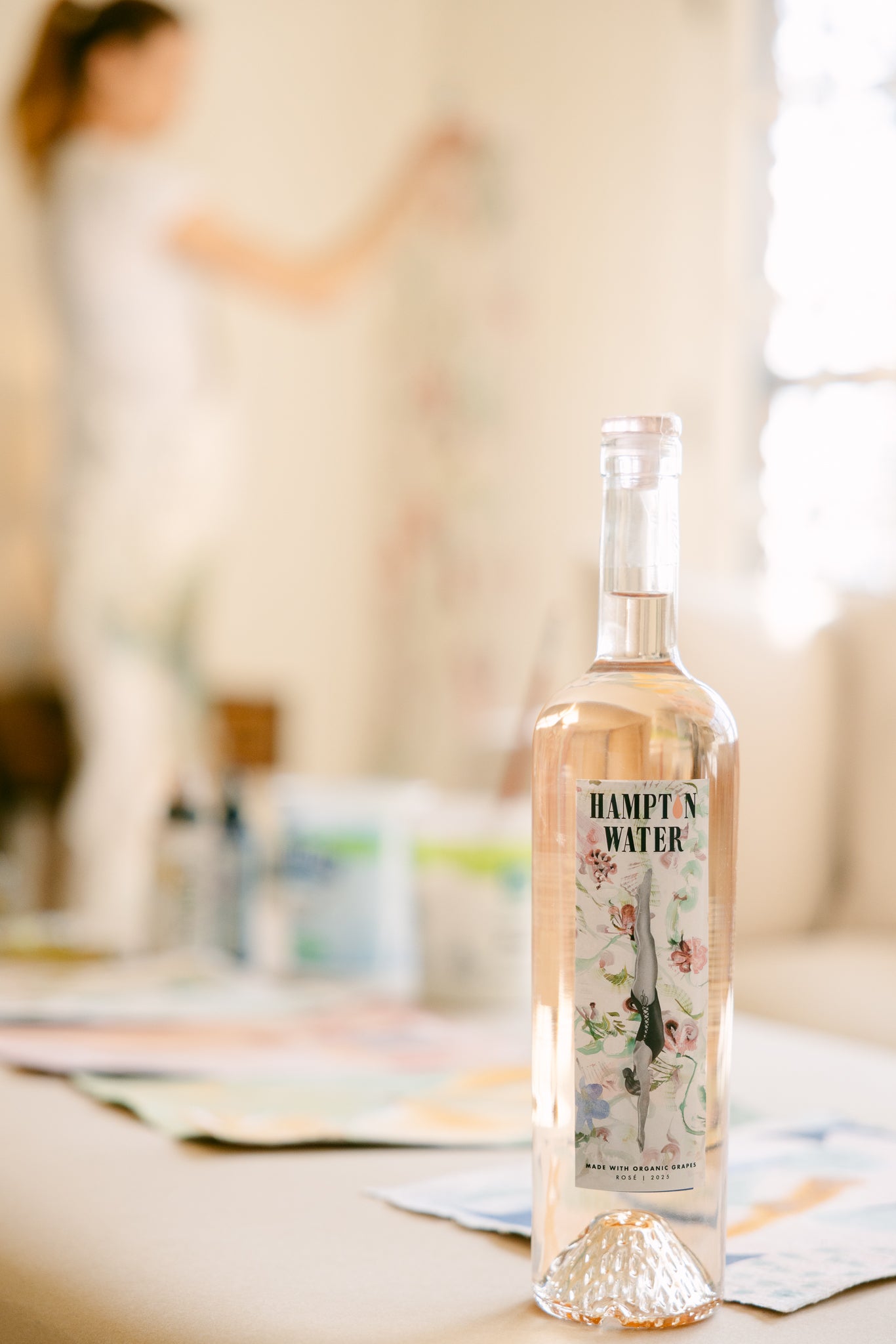 Bottle of Hampton Water on a table with a blurred background
